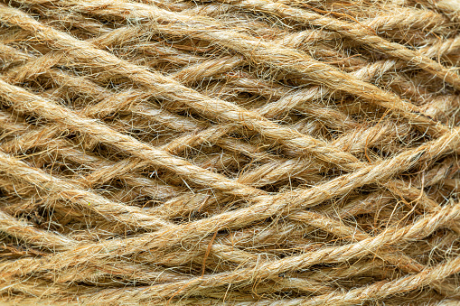Natural made macro rope texture,Coarse rope made of natural fiber material - sisal plant. Macro photo of texture, background