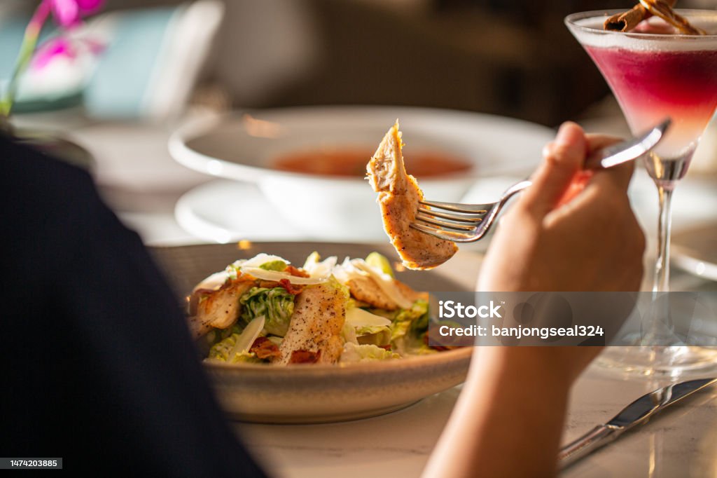 woman eating at the table,Young Asia woman eating spaghetti at restaurant Restaurant Stock Photo
