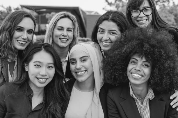 istock Multiethnic business women smiling on camera - Black and white editing 1474205149