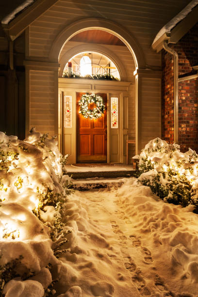 istock Christmas lights outside snowy home 1474205303