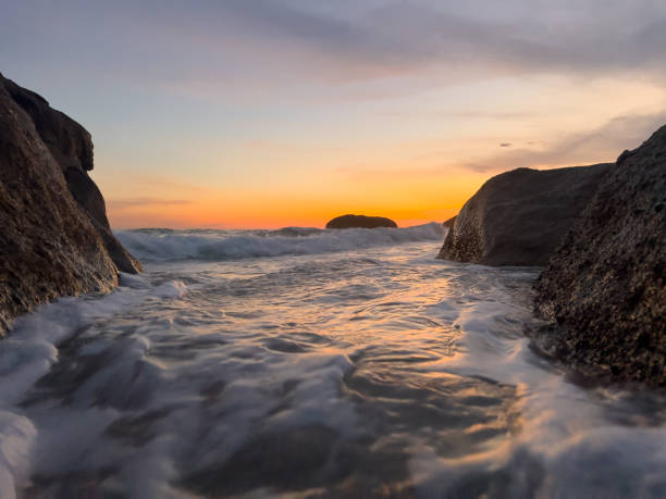 Waves hitting stones by the beach