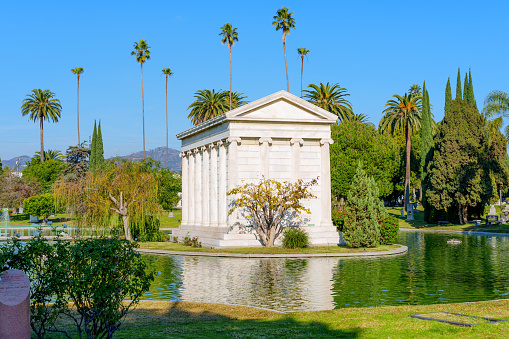 Los Angeles, California - December 20, 2022: Mausoleum and Pond at Hollywood Forever Cemetery