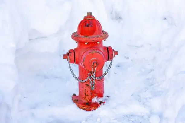 Photo of Winter Safety: Red Fire Hydrant in Snowy Scene