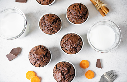 Fresh chocolate carrot muffins with drink. toning