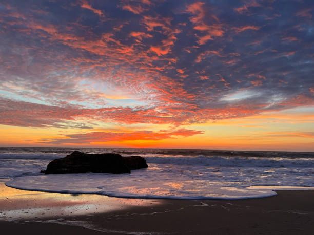 istock Sunset at Manhattan Beach California with rock 1474212632