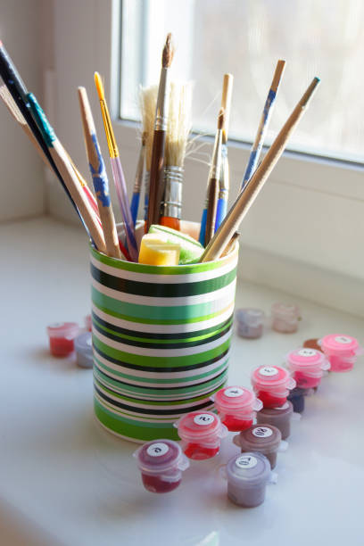 istock Set of different paint brushes in the glass 1474215415