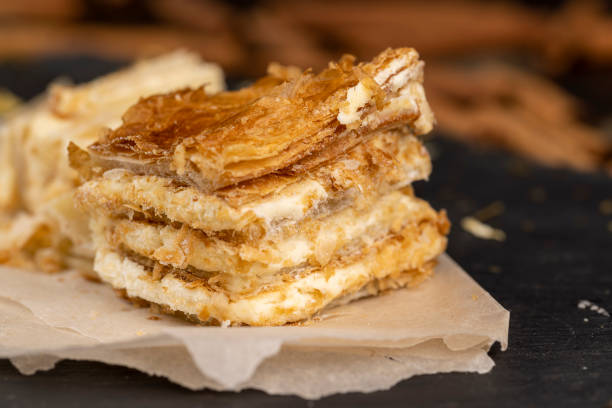 cake using sweet cream with lots of thin layers, multi-layered sweet cake on the table