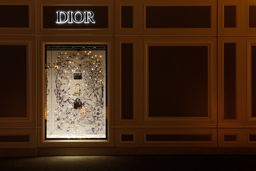 Vienna, Austria - January 6, 2023: Night View of a shop window of Dior shop in the city center