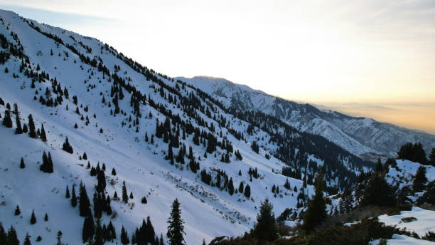 istock Epic red-orange sunset in high snowy mountains 1474219922