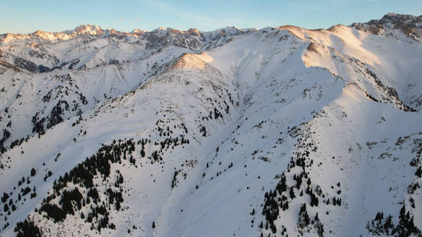 istock Epic red-orange sunset in high snowy mountains 1474219925