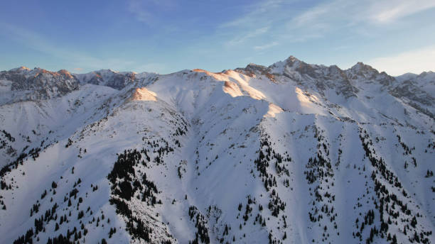 istock Epic red-orange sunset in high snowy mountains 1474219936
