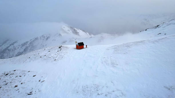 Rescue hut high in the mountains among the clouds