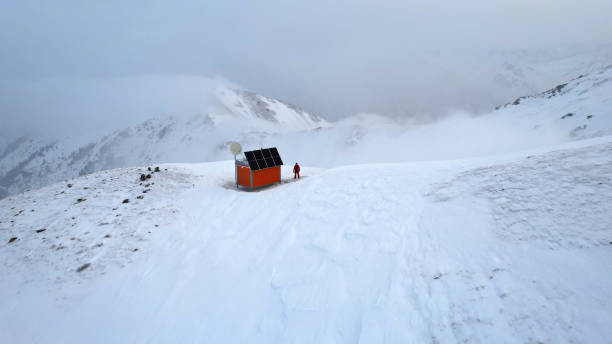 Rescue hut high in the mountains among the clouds