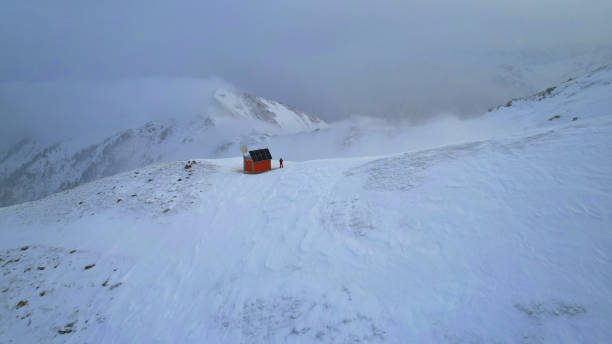 Rescue hut high in the mountains among the clouds
