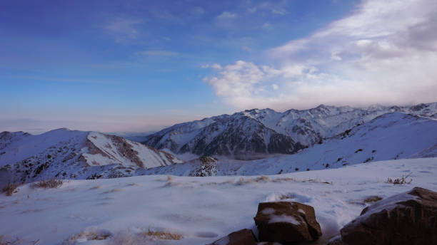 istock Ocean of clouds in snowy mountains at dawn 1474220072