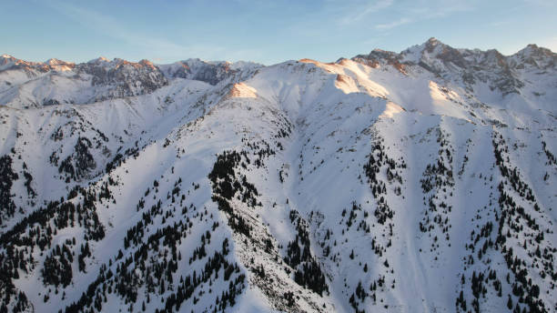 istock Epic red-orange sunset in high snowy mountains 1474220086