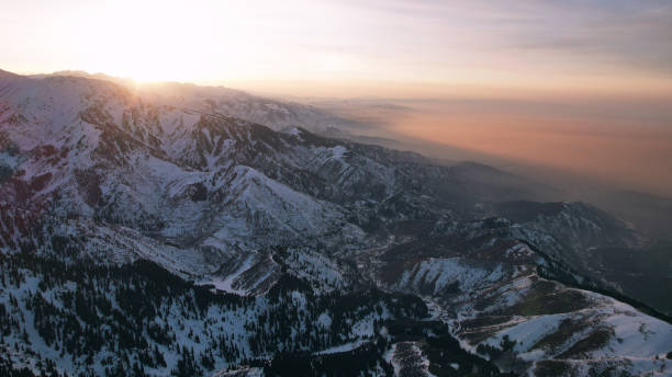istock Epic red-orange sunset in high snowy mountains 1474220100