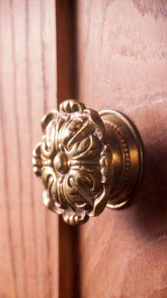 istock Brass handle in wood wardrobe door 1474220367