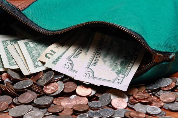 istock Currency and Coins green bag 1474222188