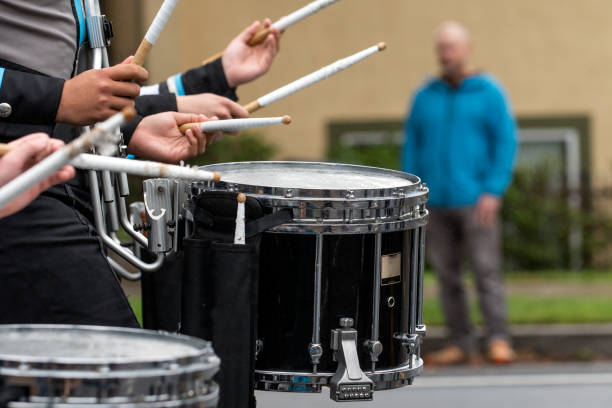 istock High school marching band keeping perfect cadence. 1474226353