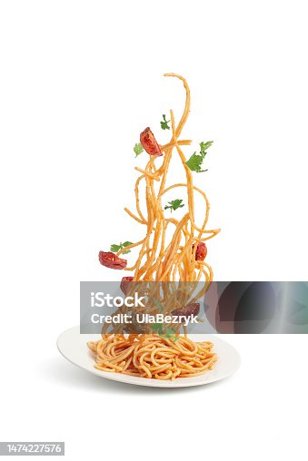 istock Pasta with tomatoes and basil falling into a plate, levitation.White saucepan with pasta and vegetables, tomatoes and herbs flying in the air on a white isolated background. Levitation. 1474227576