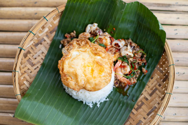 Stir fried pork with holy basil with fried egg.