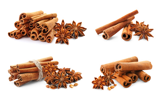 Set with aromatic cinnamon sticks and anise stars with seeds on white background