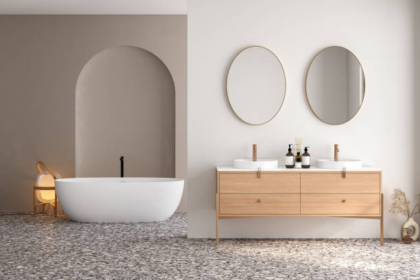 istock Bright bathroom interior with double sink and mirror, terrazzo floor, bathtub, plants. Bathing accessories and modern furniture. 3D rendering 1474228813