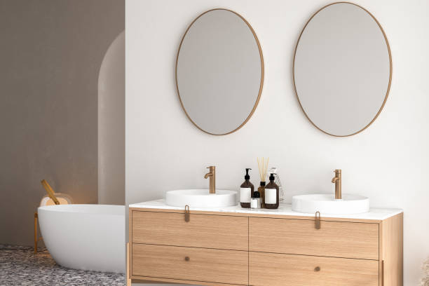istock Bright bathroom interior with double sink and mirror, terrazzo floor, bathtub, plants. Bathing accessories and modern furniture. 3D rendering 1474228817