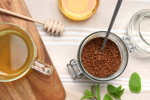 istock Buckwheat tea, granules and honey on table, flat lay 1474228872