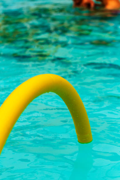 istock Brightly coloured noodles on the pool 1474229558