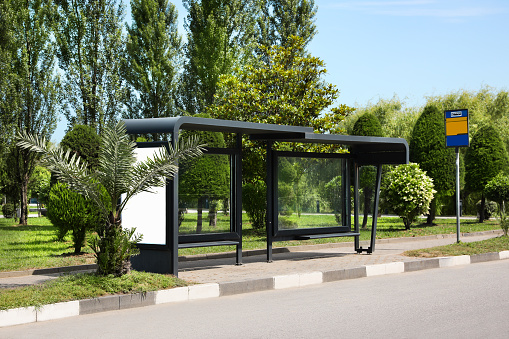 Public transport stop with benches on city street