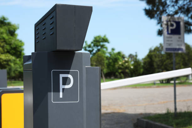 istock Modern parking meter outdoors on sunny day, closeup. Space for text 1474230196
