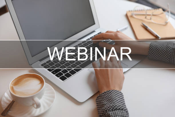 istock Webinar concept. Woman working with laptop at table indoors, closeup 1474231042