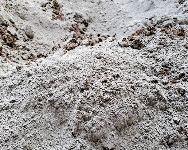 istock close up cement powder with sand. Construction worker 1474234767