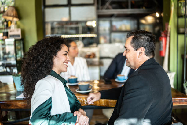Colleagues having a conversation at a coffee shop