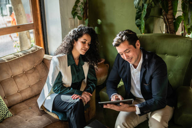 istock Colleagues having a meeting at a coffee shop 1474237793