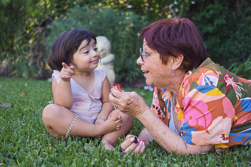 grandmother playing with her granddaughter. High quality photo