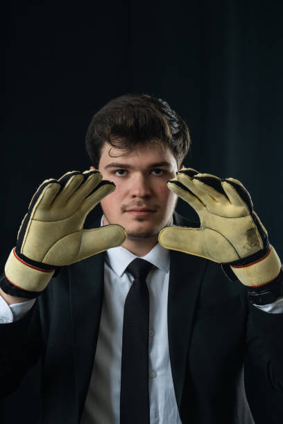 istock The goalkeeper in a black suit. 1474240683