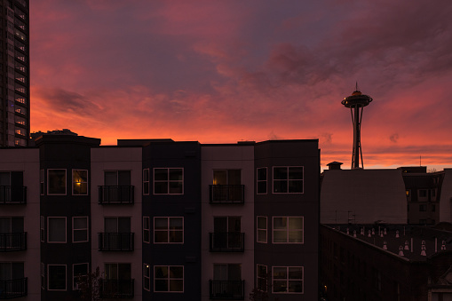 Seattle, USA - Nov 25, 2022: A vivid sunset over downtown as the nightly commute begins.