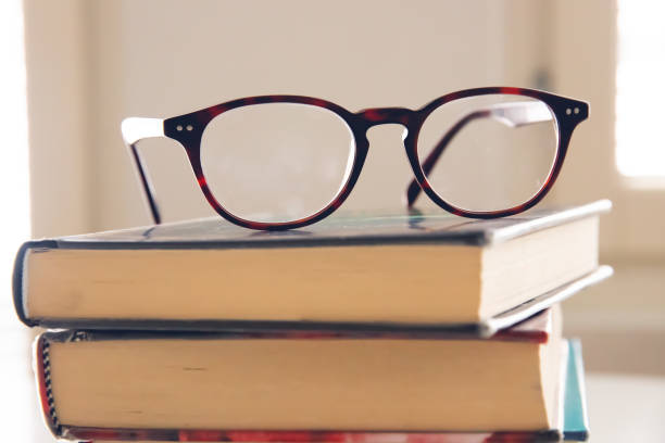 istock stack of books witht eyeglasses on top of them 1474242434