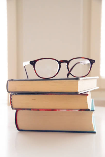 istock stack of books witht eyeglasses on top of them 1474242439