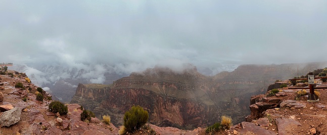 Panorama of the West Rim of the Grand Canyon overlooking the Skywalk on a cloudy foggy day