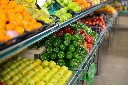 on shelves of  supermarket are fresh and juicy fruits and vegetables, carefully harvested on farm plantations