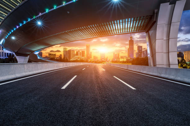 istock Road and bridge with skyline at sunset 1474263433