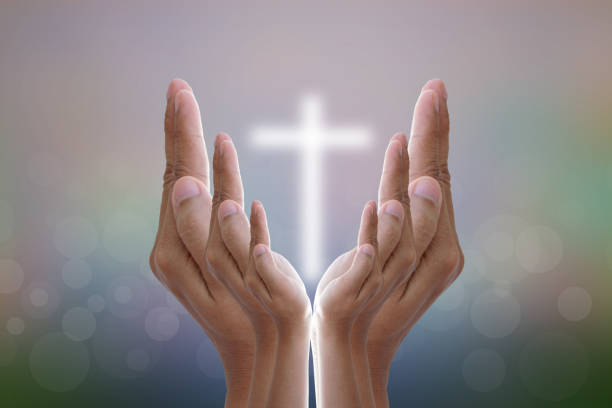 istock Hands bless the cross in the sky. 1474265269