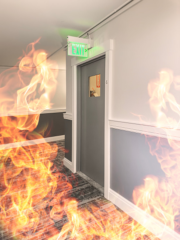 Emergency exit door during fire with flames