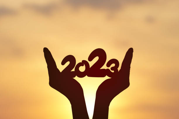 istock 2023 silhouette on human hand. Happy new year concept. 1474268414