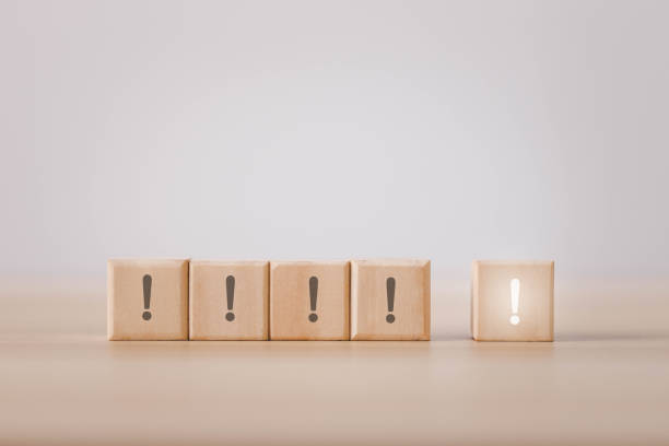 istock wooden blocks with exclamation marks arranged or stacked on a table 1474269159