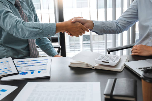 istock Business Shaking hands greeting new colleagues after during job interview 1474280408